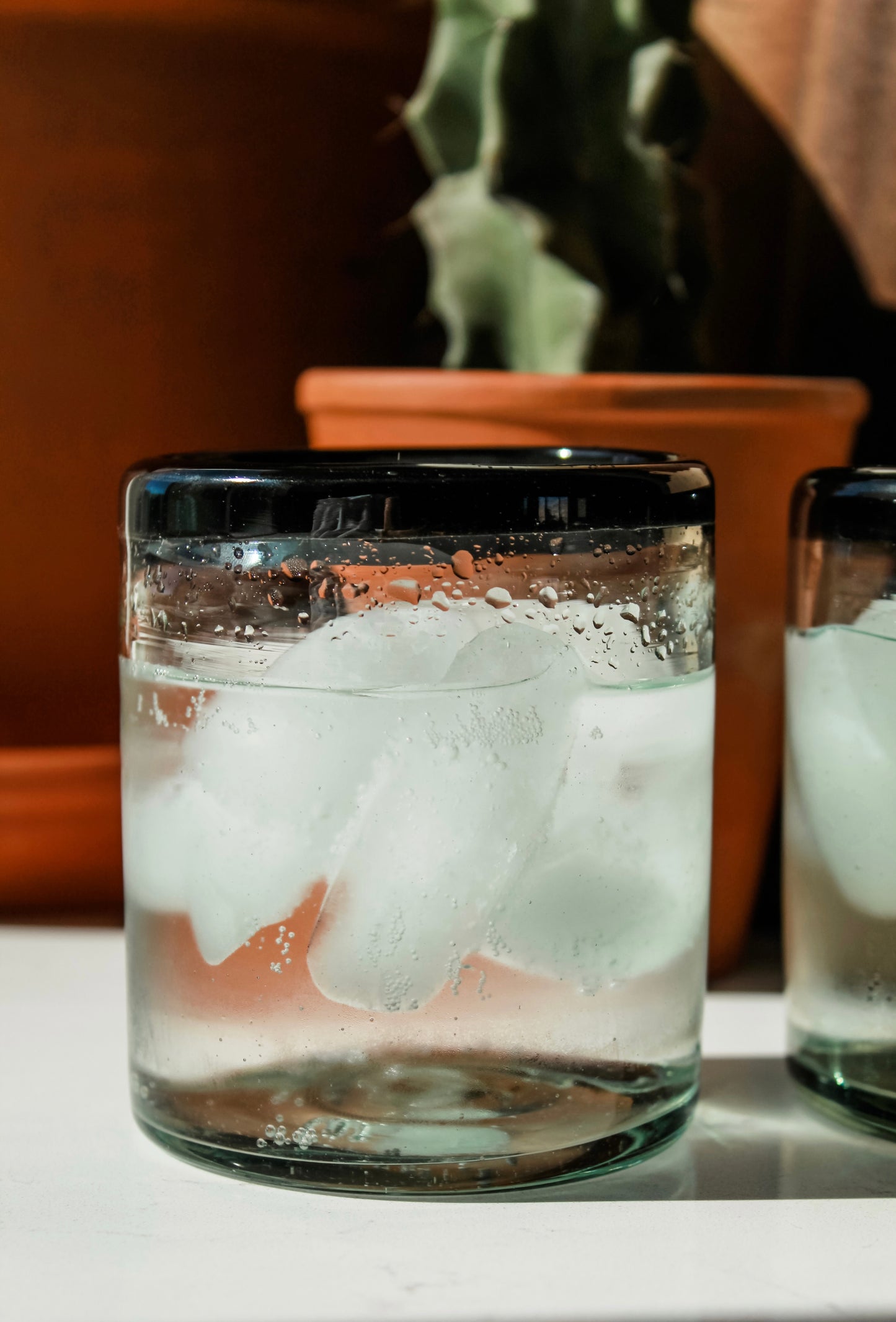 Black rimmed drinking glasses
