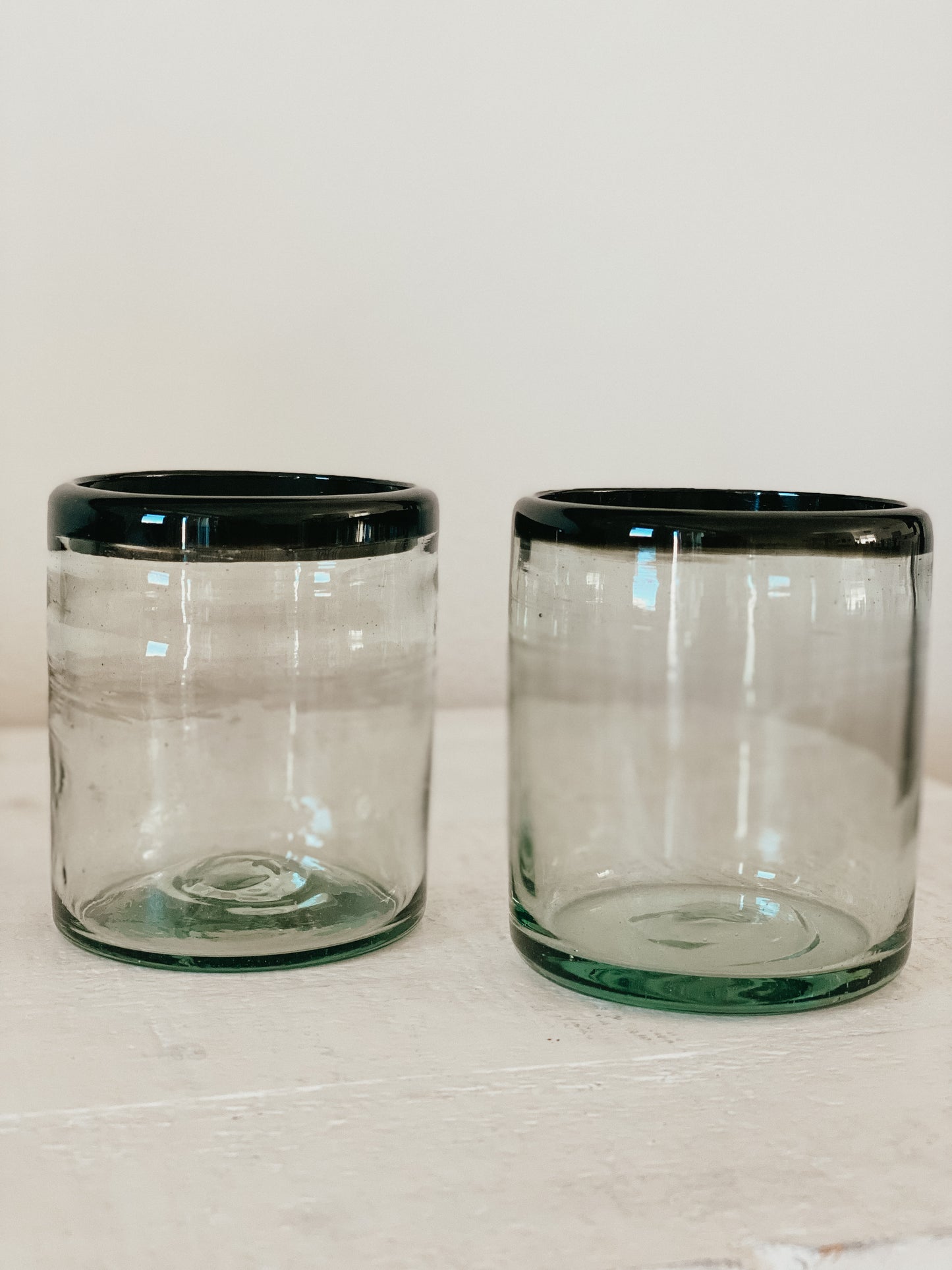 Hand blown glass tumbler with unique black rim