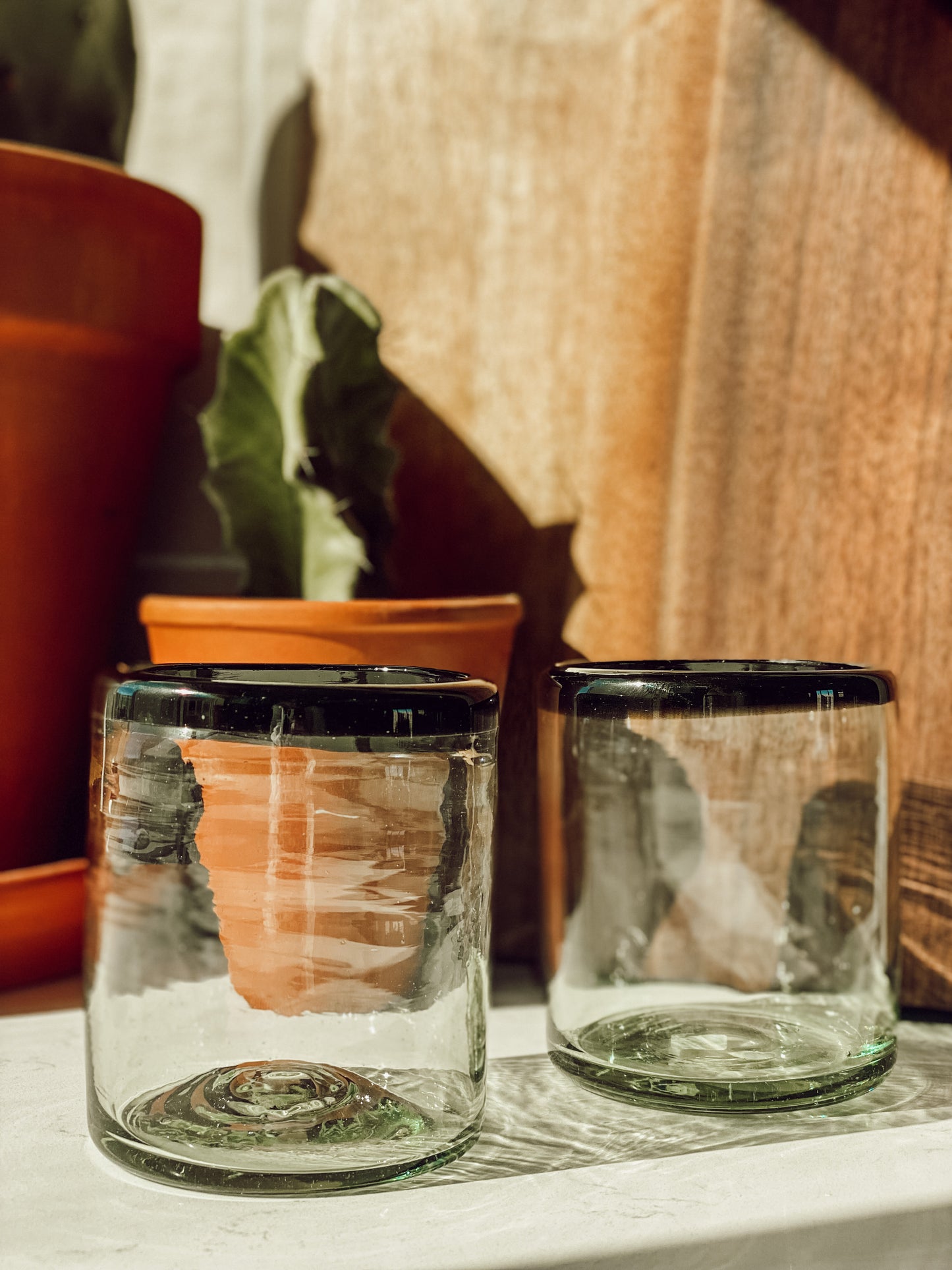 Black rimmed glass tumbler