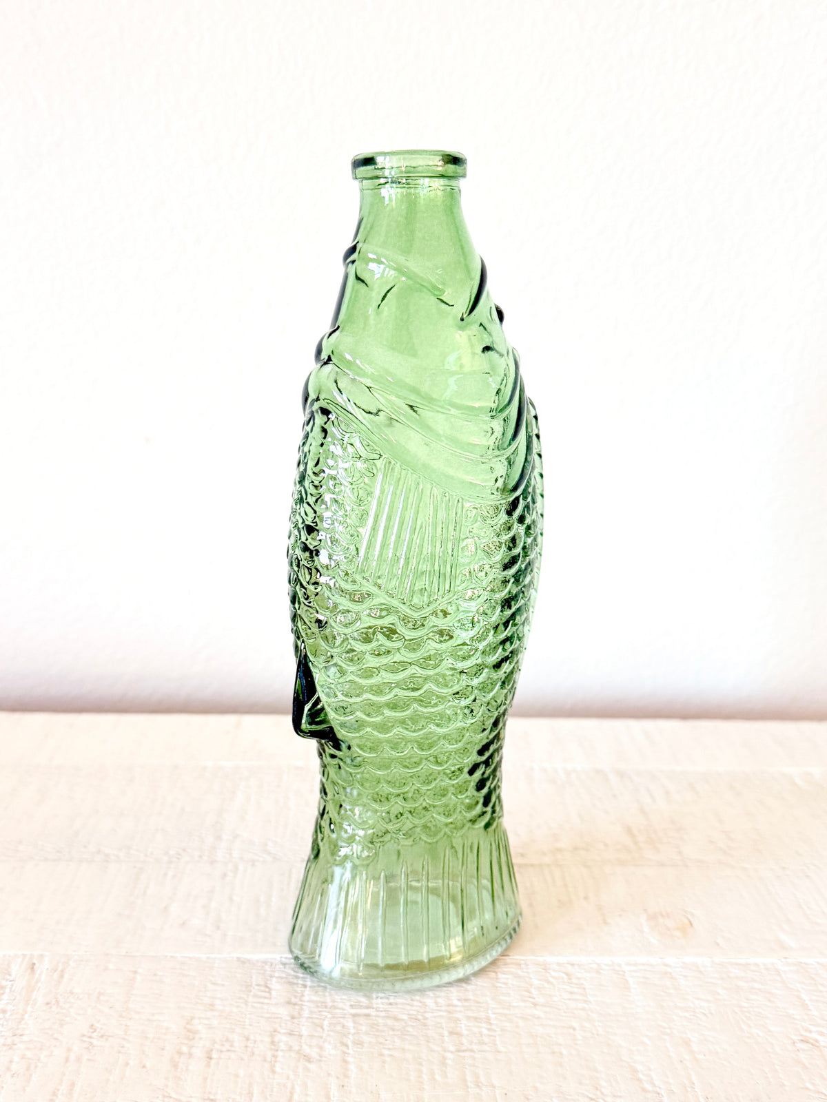 Green glass fish vase
