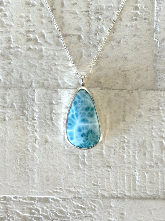 Handmade sterling silver larimar teardrop pendant necklace with natural ocean-blue stone.