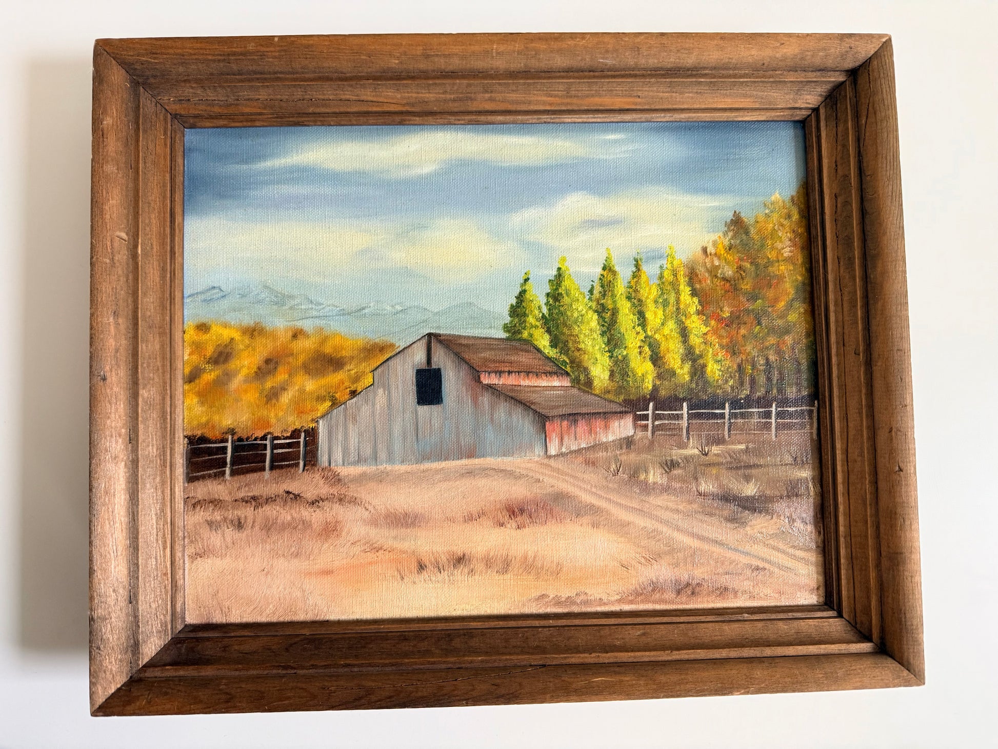 Vintage farm landscape painting with rustic barn and wood frame