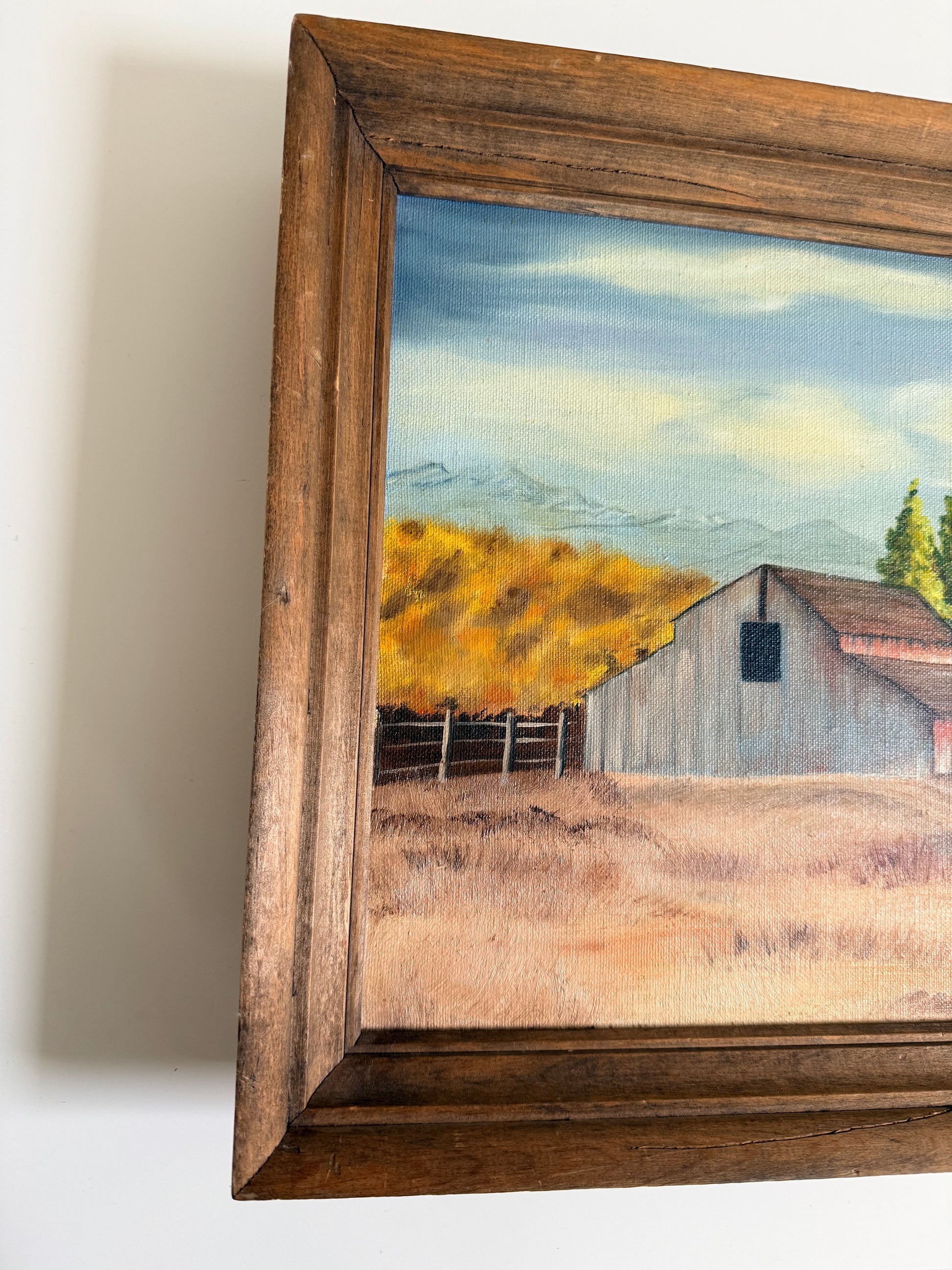 Vintage farm landscape painting with rustic barn and wood frame