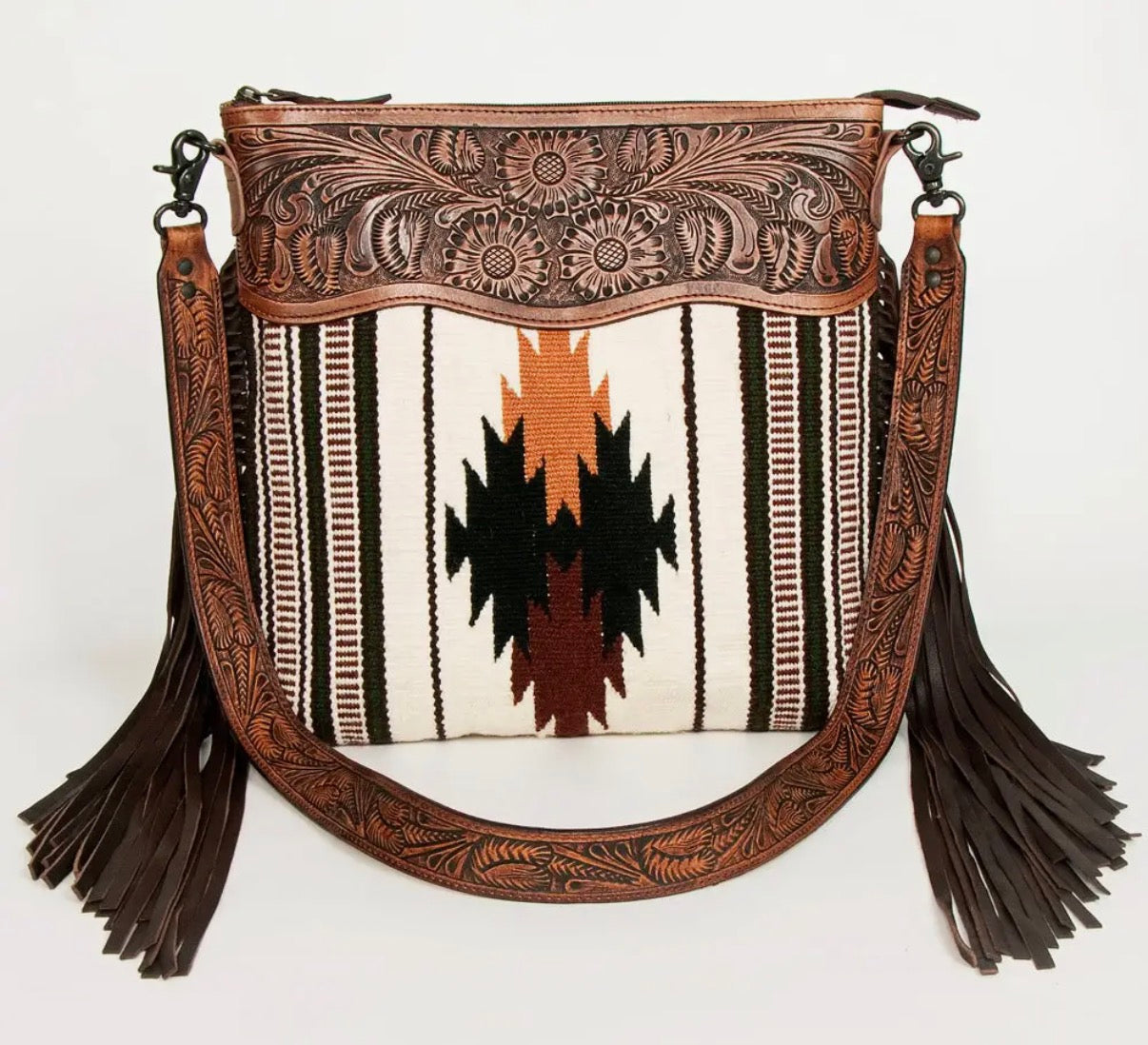 southwestern tooled leather fringe purse with aztec design