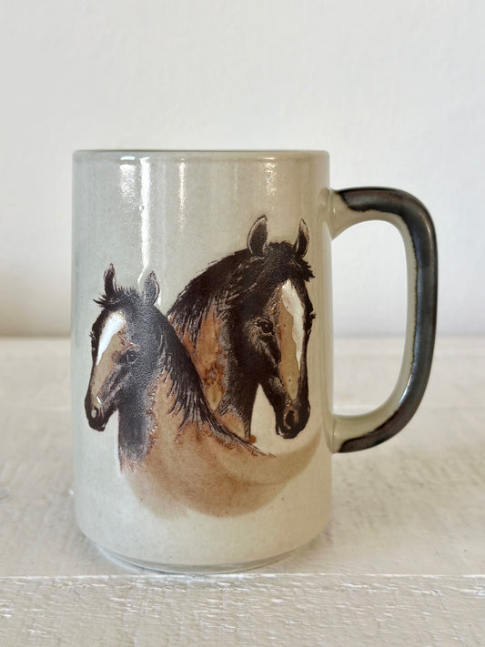 Mug with horse design on a white surface