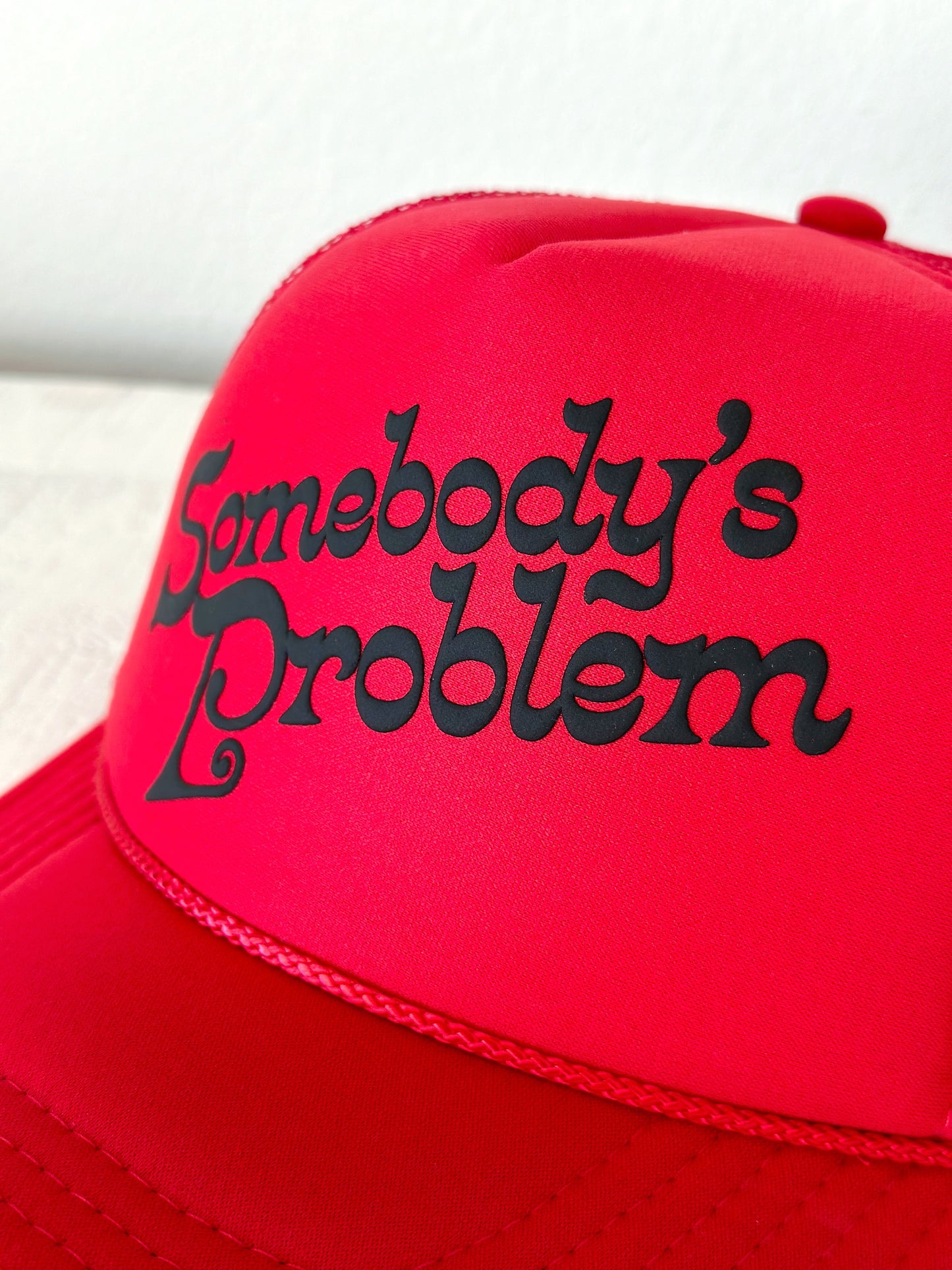 Somebody’s Problem Trucker Hat