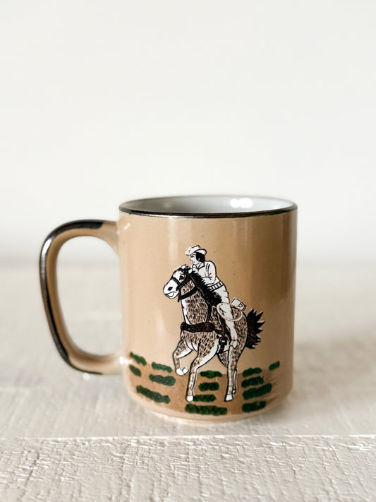 Vintage cowboy bronc rider coffee mug.
